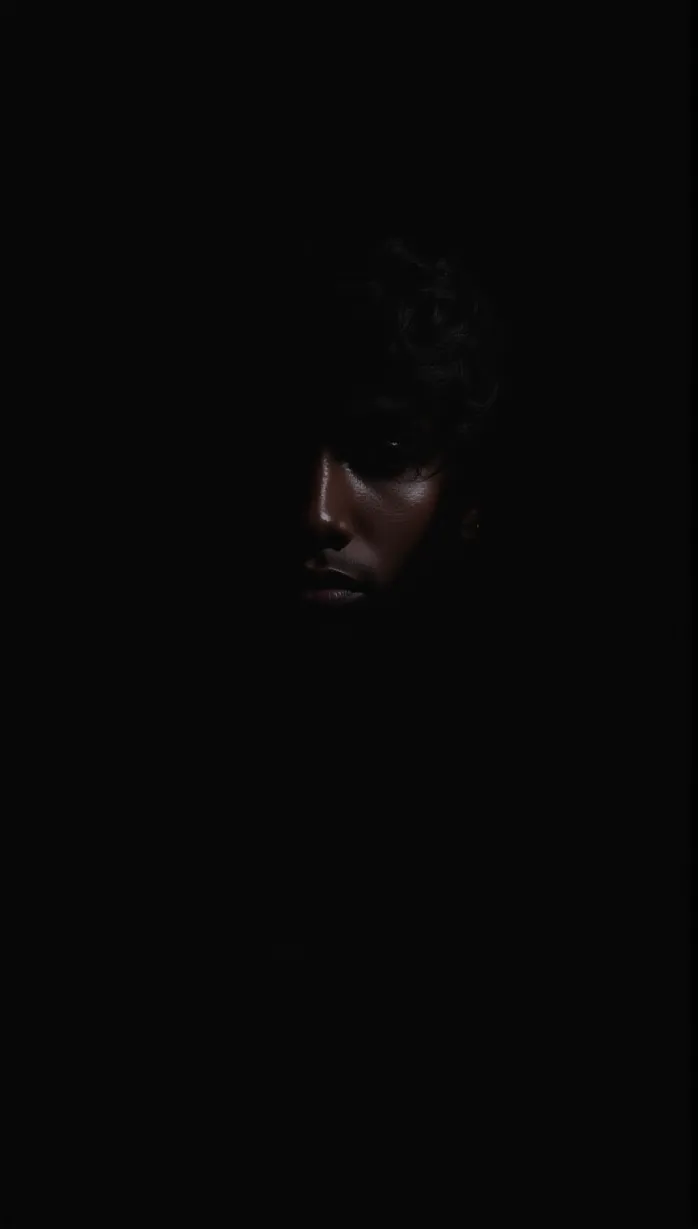 Image male, young adult, dark skin, black hair, shadowy figure, mysterious aura, fear in the air, unseen eyes, covered face, upper body, seductive pose, ominous lighting, dramatic shadows, dark environment, masterpiece, best quality, detailed